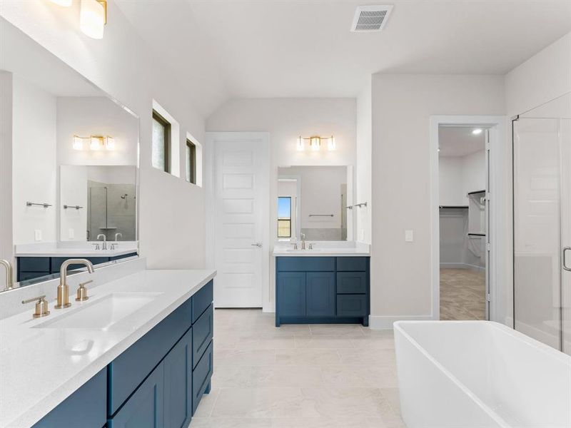 Separate Vanities, Enclosed Toilet, and Freestanding Tub