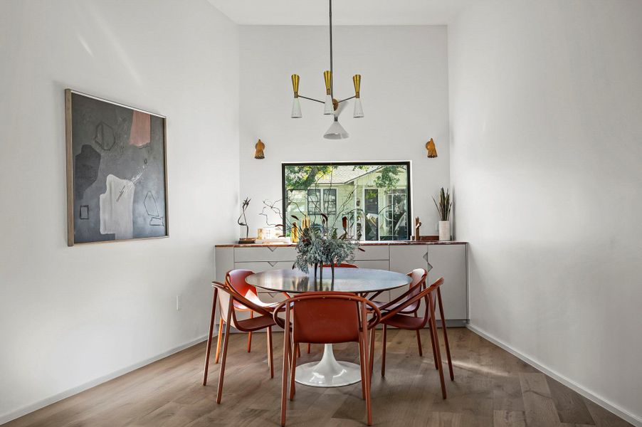 Dining room with mid century chandelier and wet bar Dining room with mid century chandelier and wet bar
