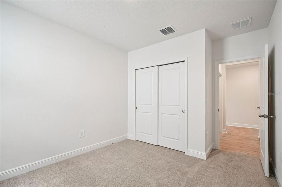 Spacious, unfurnished interior of a new home in The Reserve at Hammock Oaks - Signature Series, Lady Lake (Image 18).