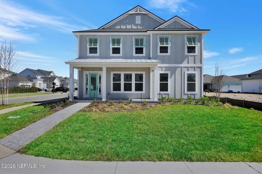 Front exterior of a new home in Seabrook Village at Seabrook, Ponte Vedra, FL, highlighting curb appeal (Image 20).