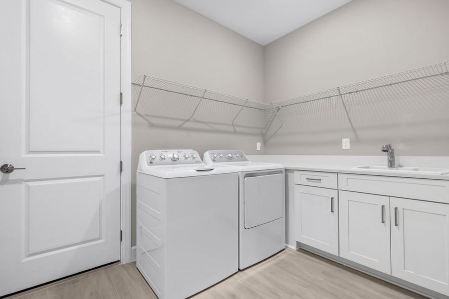 Furnished interior view inside a new home in Esplanade at Starling, Punta Gorda (Image 9).