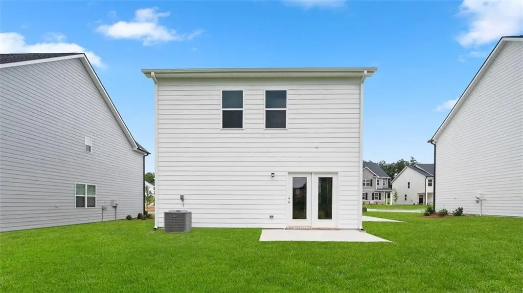 Exterior details and patio area of a home in Oakchase at Hampton, Hampton (Image 2).