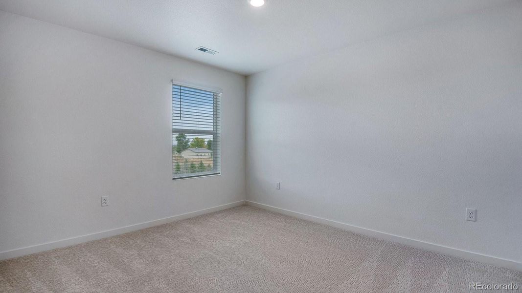 Spacious, unfurnished interior of a new home in Trails at Crowfoot, Parker (Image 28).