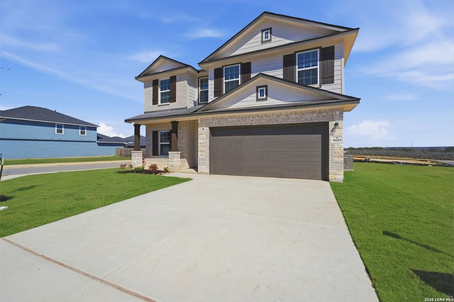 Front exterior of a new home in Hickory Ridge, Elmendorf, TX, highlighting curb appeal (Image 2).