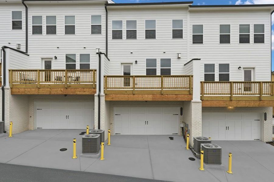 Exterior details and patio area of a home in Towns at Creekside, Doraville (Image 2). Exterior details and patio area of a home in Towns at Creekside, Doraville (Image 2).