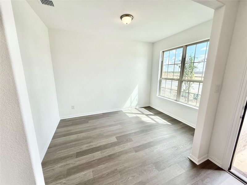 Empty room featuring light wood finished floors and baseboards Empty room featuring light wood finished floors and baseboards