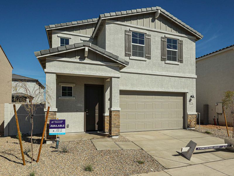 A grey house with garages. A grey house with garages.