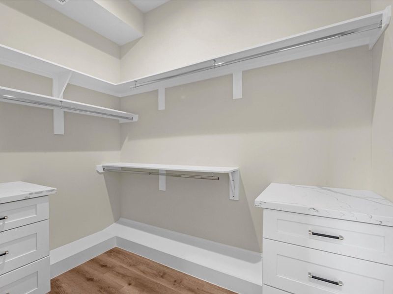 Experience the spacious walk-in closet, designed with custom Drawers andluxurious quartz countertops. This stylish and functional space offers ample storage while adding atouch of elegance to you organization. Experience the spacious walk-in closet, designed with custom Drawers andluxurious quartz countertops. This stylish and functional space offers ample storage while adding atouch of elegance to you organization.