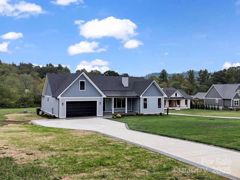 Front exterior of a new home in , Fletcher, NC, highlighting curb appeal (Image 24). Front exterior of a new home in , Fletcher, NC, highlighting curb appeal (Image 24).