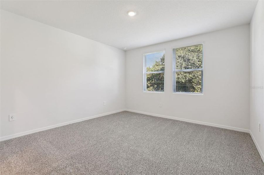 Spacious, unfurnished interior of a new home in Bradbury Creek - Signature Series, Haines City (Image 25).