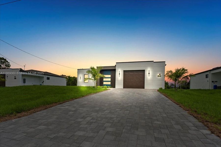 Front exterior of a new home in , Lehigh Acres, FL, highlighting curb appeal (Image 13). Front exterior of a new home in , Lehigh Acres, FL, highlighting curb appeal (Image 13).