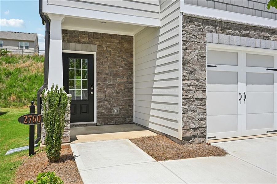 Front exterior of a new home in Hawthorne Station, College Park, GA, highlighting curb appeal (Image 24).