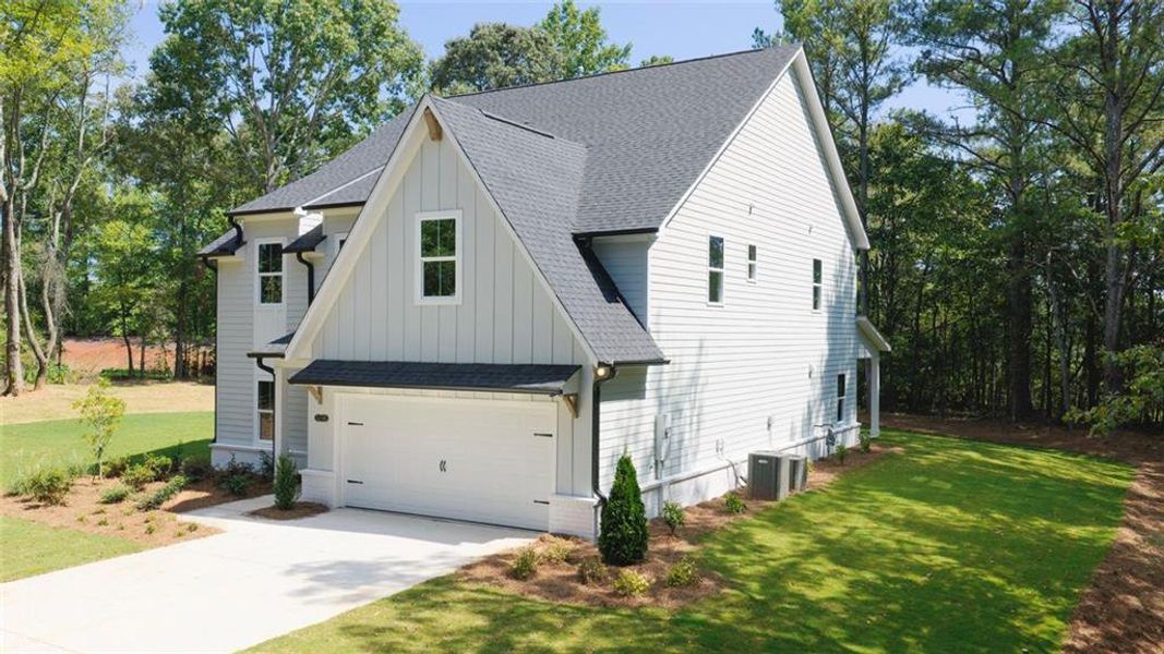 Front exterior of a new home in , Cumming, GA, highlighting curb appeal (Image 25).
