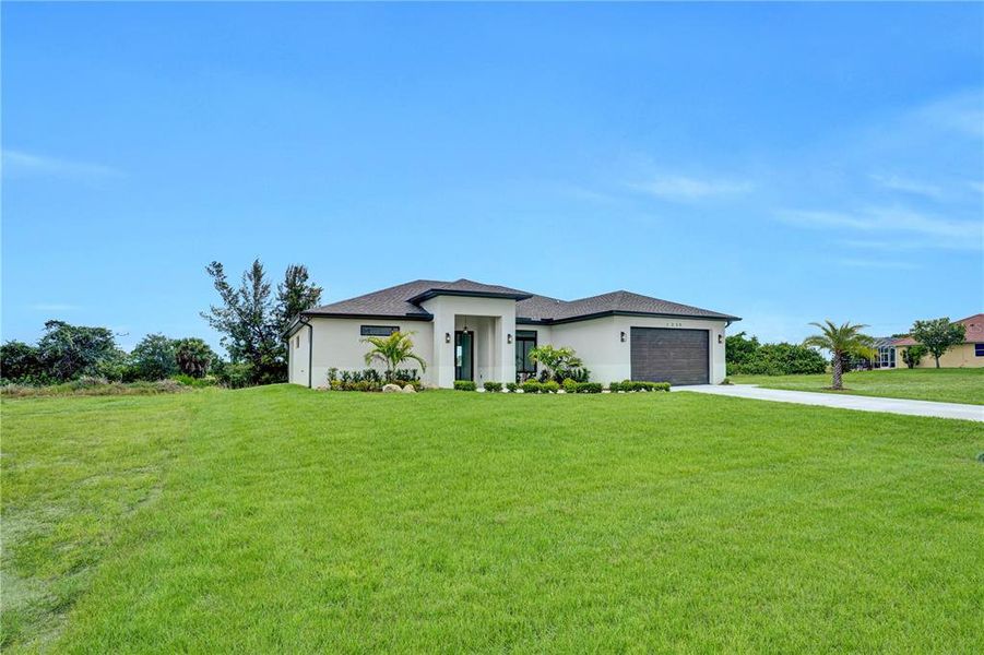 Front exterior of a new home in , Cape Coral, FL, highlighting curb appeal (Image 26).