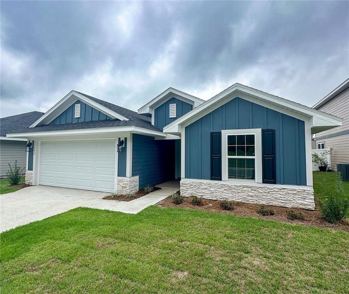 Front exterior of a new home in Briarwood, Alachua, FL, highlighting curb appeal (Image 1). Front exterior of a new home in Briarwood, Alachua, FL, highlighting curb appeal (Image 1).