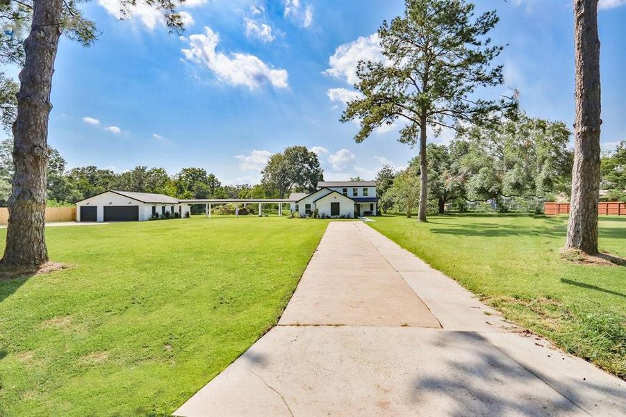 Peaceful Living with Uninterrupted Urban Views. Oversized breezeway and 6' wide concrete walkway from garage to main house.