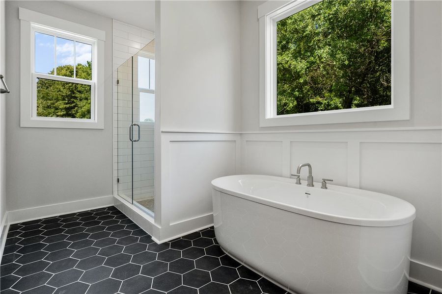 Indulge in a tranquil bathing experience in this s