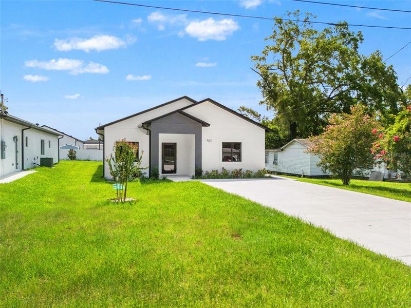 Front exterior of a new home in , Apopka, FL, highlighting curb appeal (Image 23). Front exterior of a new home in , Apopka, FL, highlighting curb appeal (Image 23).