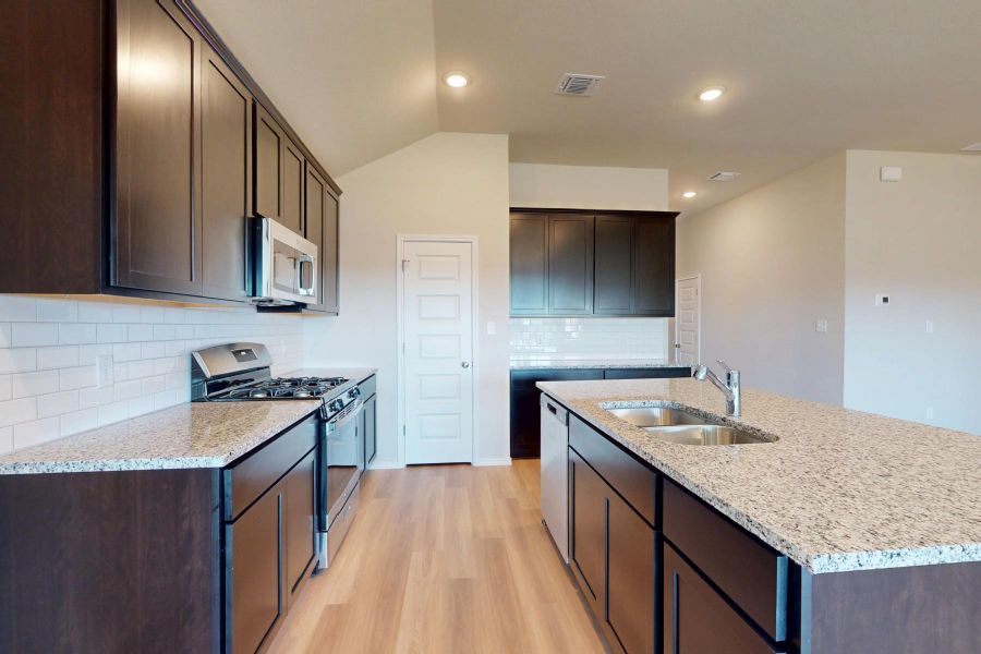 Furnished interior view inside a new home in Carillon, Manor (Image 9).
