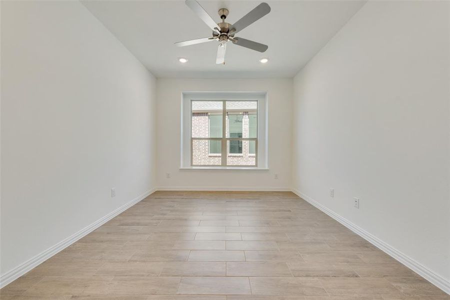 Spare room with ceiling fan