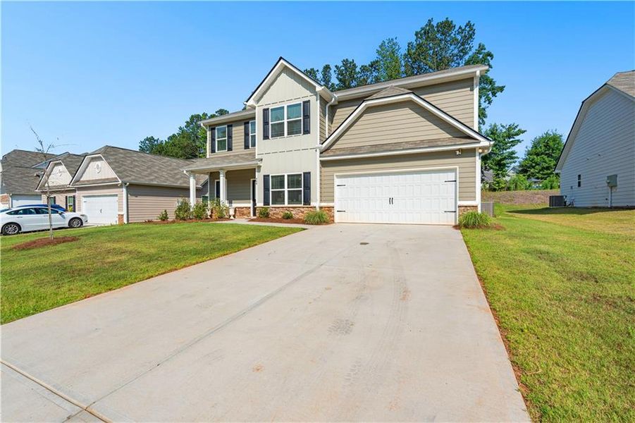 Front exterior of a new home in , Villa Rica, GA, highlighting curb appeal (Image 1). Front exterior of a new home in , Villa Rica, GA, highlighting curb appeal (Image 1).
