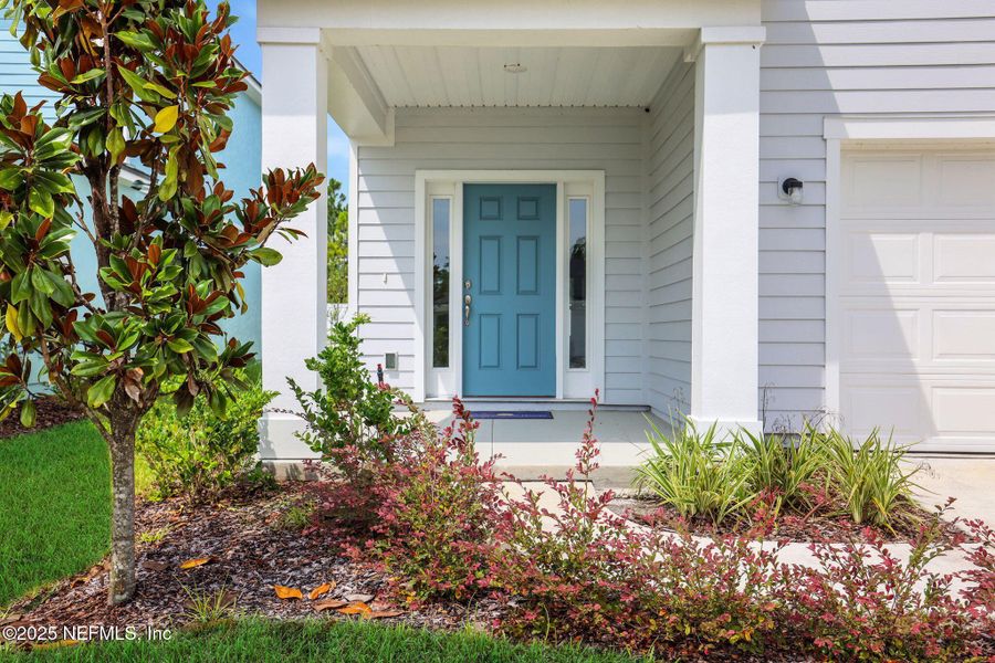 Front exterior of a new home in Cordova Palms, St. Augustine, FL, highlighting curb appeal (Image 19).