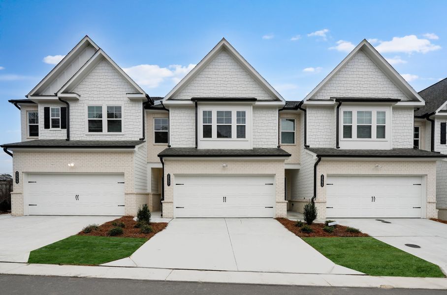 Front exterior of a new home in Towns at Creekside: Towns at Creekside 24', Doraville, GA, highlighting curb appeal (Image 1). Front exterior of a new home in Towns at Creekside: Towns at Creekside 24', Doraville, GA, highlighting curb appeal (Image 1).