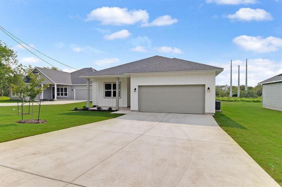 Front exterior of a new home in , Marble Falls, TX, highlighting curb appeal (Image 18).