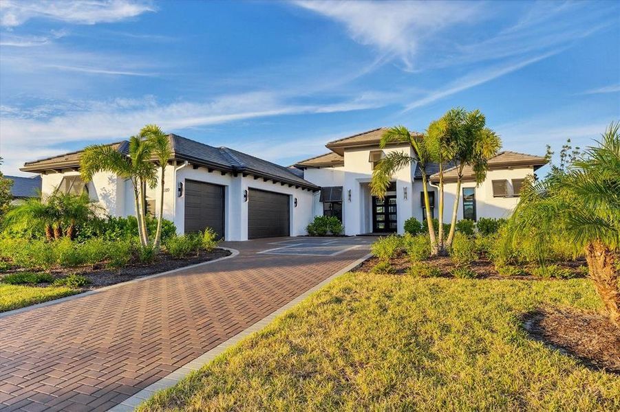 Front exterior of a new home in Wild Blue at Waterside, Sarasota, FL, highlighting curb appeal (Image 23).