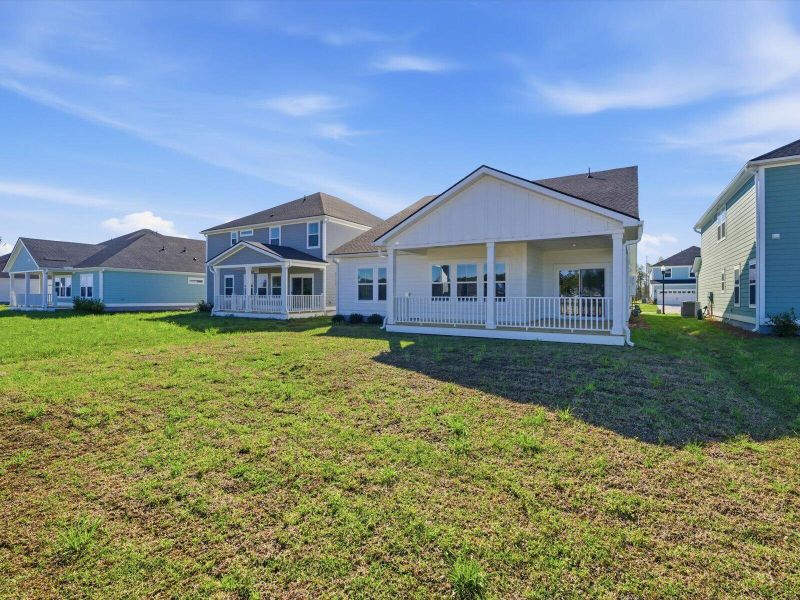 Exterior details and patio area of a home in The Coves at Lakes of Cane Bay, Summerville (Image 28).