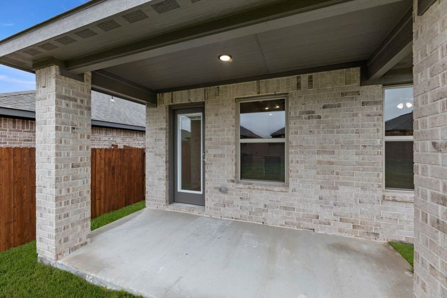 Representative exterior photo of a completed home built from the Lexington by Impression Homes in Baker Farms, Cleburne, TX (Image 28).