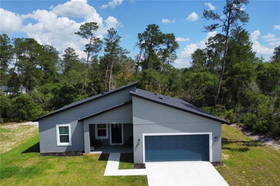 Front exterior of a new home in , Ocala, FL, highlighting curb appeal (Image 28).