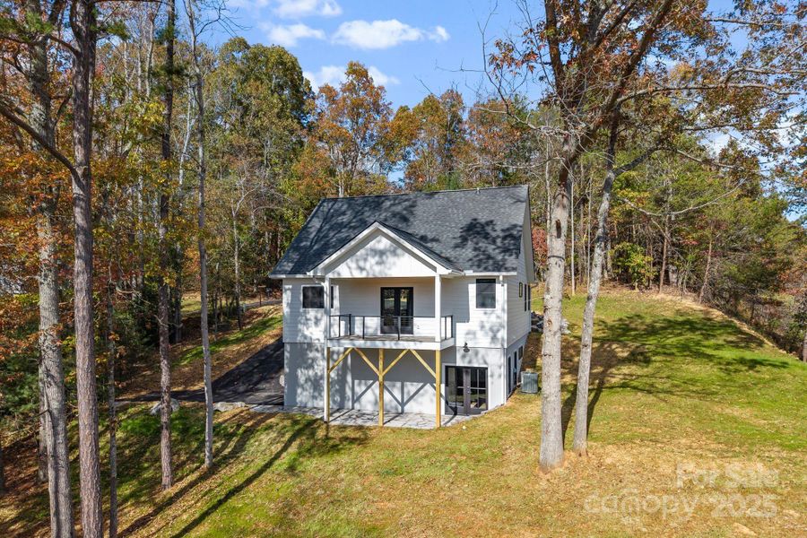 Covered deck and patio so moments of relaxation and taking in the view can be enjoyed by all.