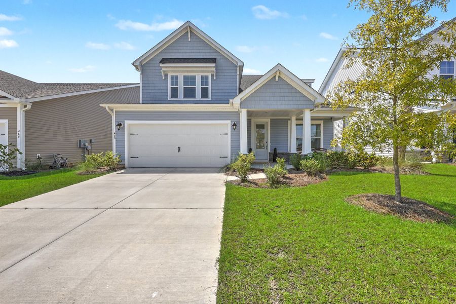 Front exterior of a new home in The Groves of Berkeley, Moncks Corner, SC, highlighting curb appeal (Image 2). Front exterior of a new home in The Groves of Berkeley, Moncks Corner, SC, highlighting curb appeal (Image 2).