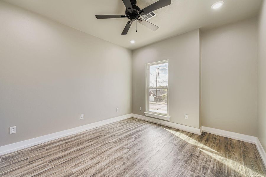 Empty room with wood finished floors, recessed lighting, and a ceiling fan