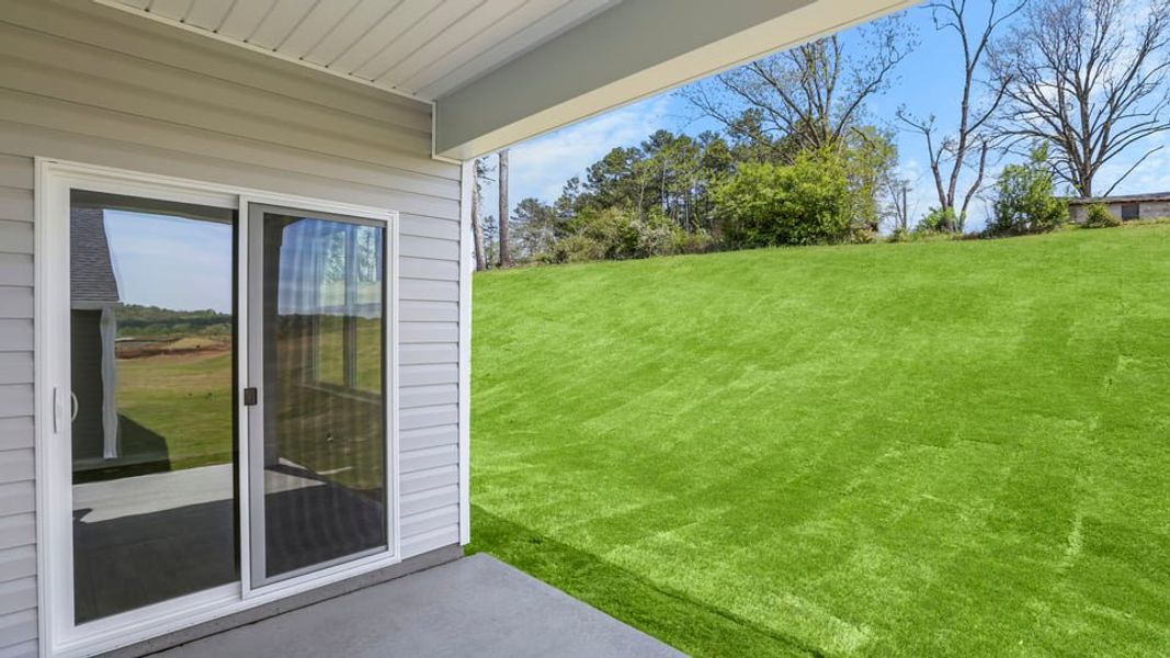 Exterior details and patio area of a home in Durbin Meadows Traditions, Fountain Inn (Image 17).