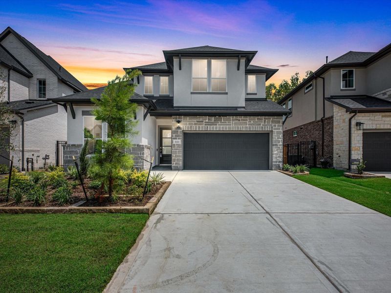 Front exterior of a new home in Woodson’s Reserve, Spring, TX, highlighting curb appeal (Image 1). Front exterior of a new home in Woodson’s Reserve, Spring, TX, highlighting curb appeal (Image 1).