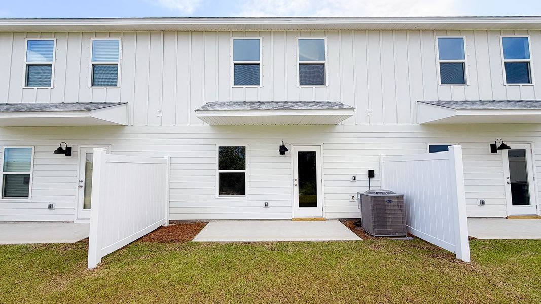 Exterior details and patio area of a home in Salt Creek Townhomes at Mexico Beach, Mexico Beach (Image 3).