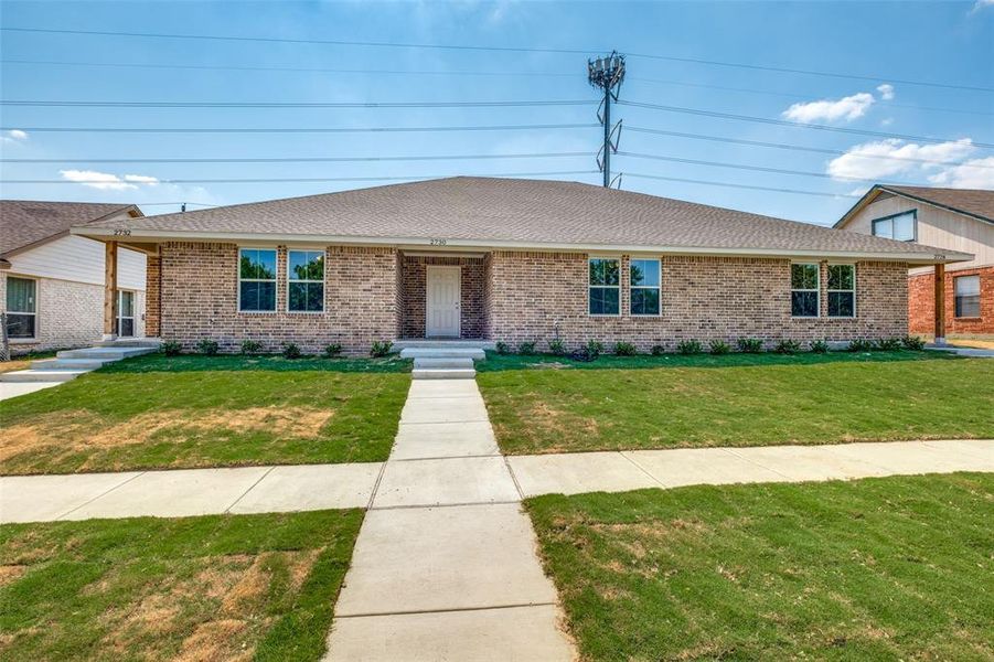 Single story home featuring a front yard