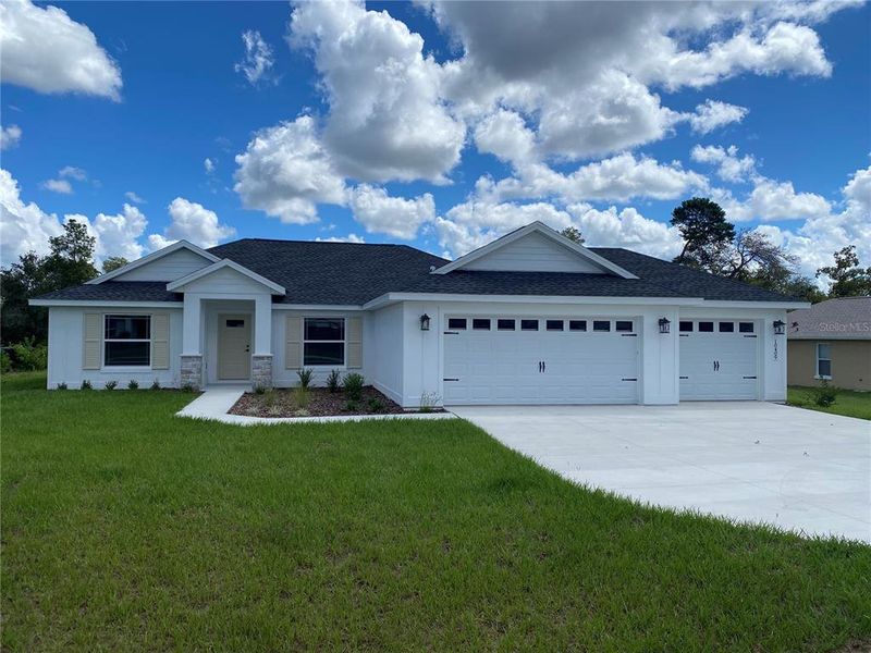Front exterior of a new home in , Ocala, FL, highlighting curb appeal (Image 28).