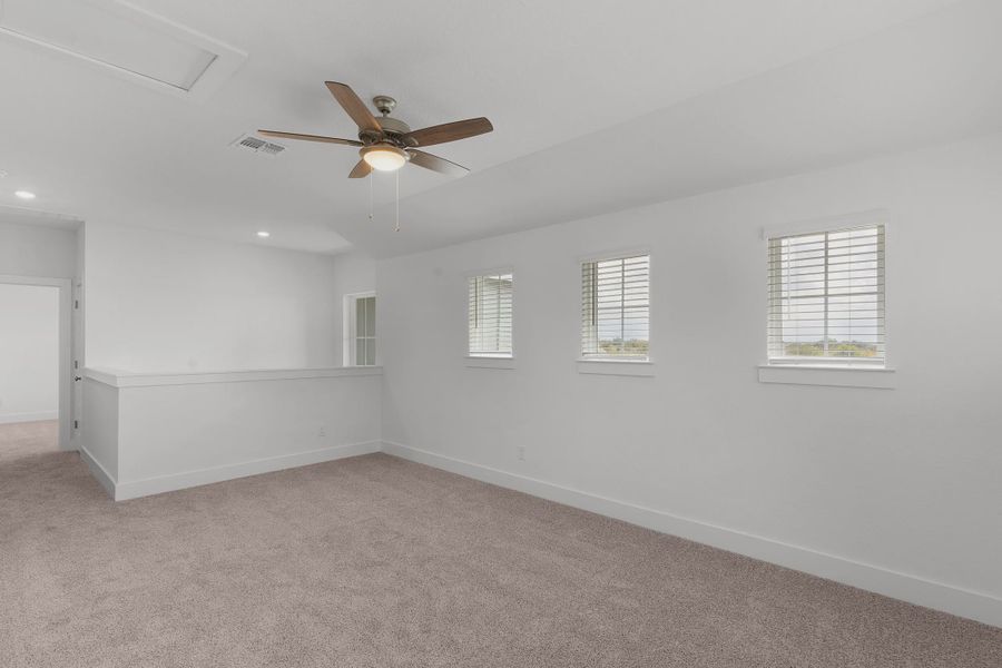 Representative unfurnished interior of a home built from the Madison by Chesmar Homes in Newhaven, Manor (Image 14).
