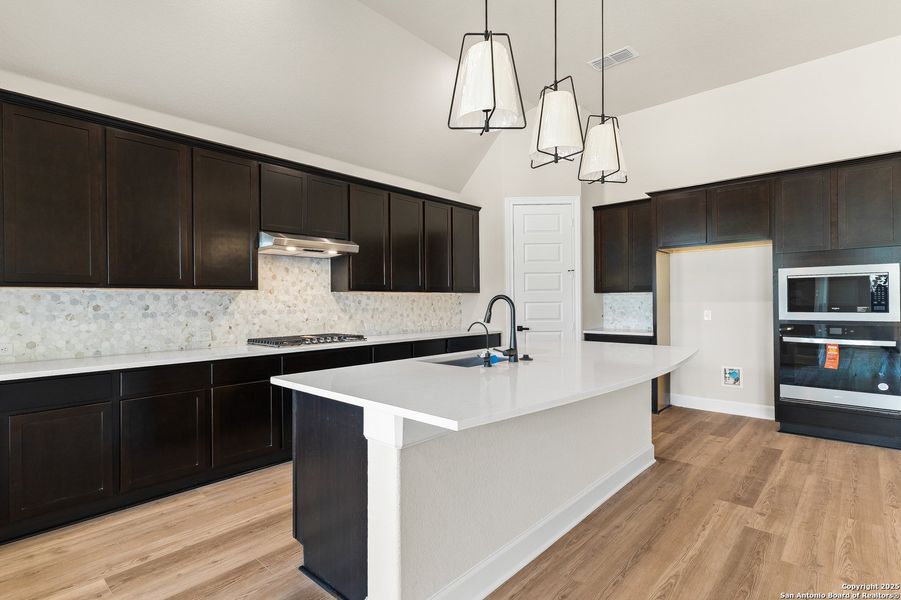 Furnished interior view inside a new home in The Enclave at Potranco Oaks, Castroville (Image 13).