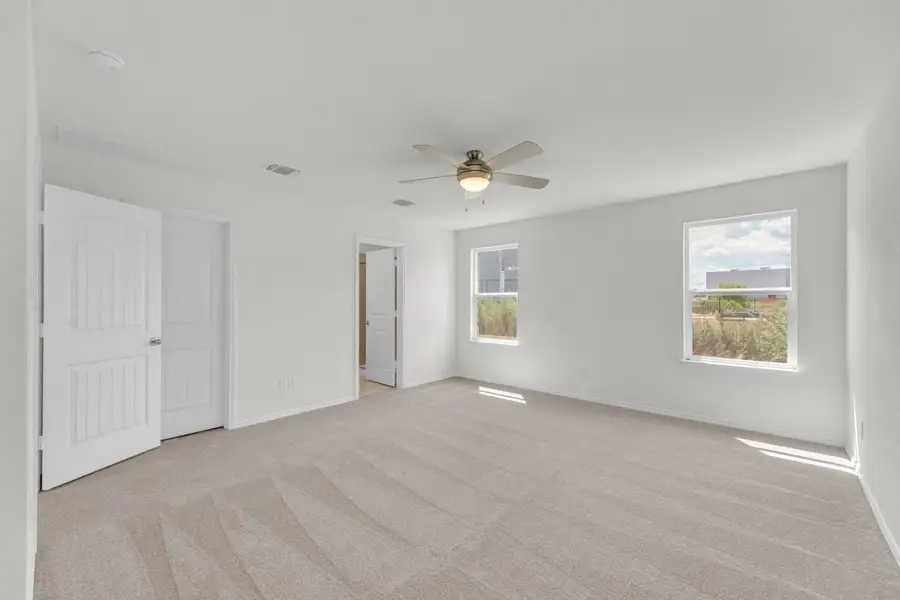 Spacious, unfurnished interior of a new home in Mustang Valley, Manor (Image 30).