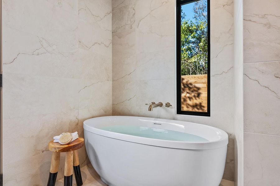 Bathroom featuring a freestanding tub
