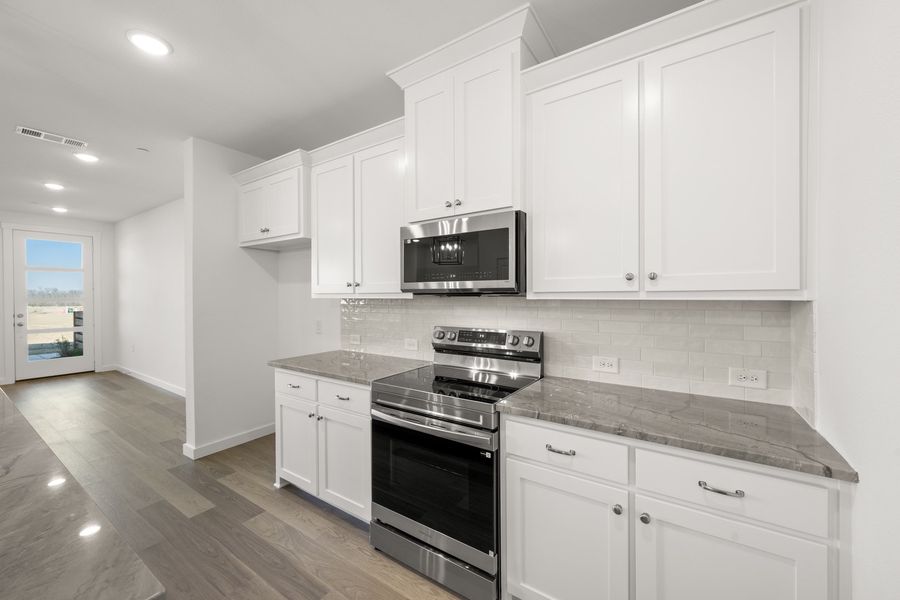 Furnished interior view inside a new home in Wildridge, Oak Point (Image 7).