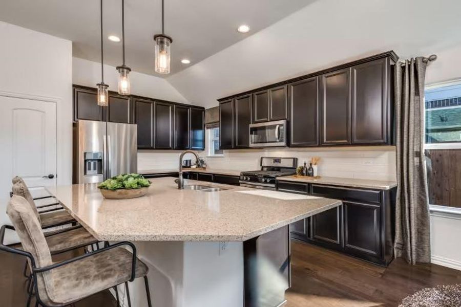 Photo of Pulte model home with same floor plan, not of actual home listed.