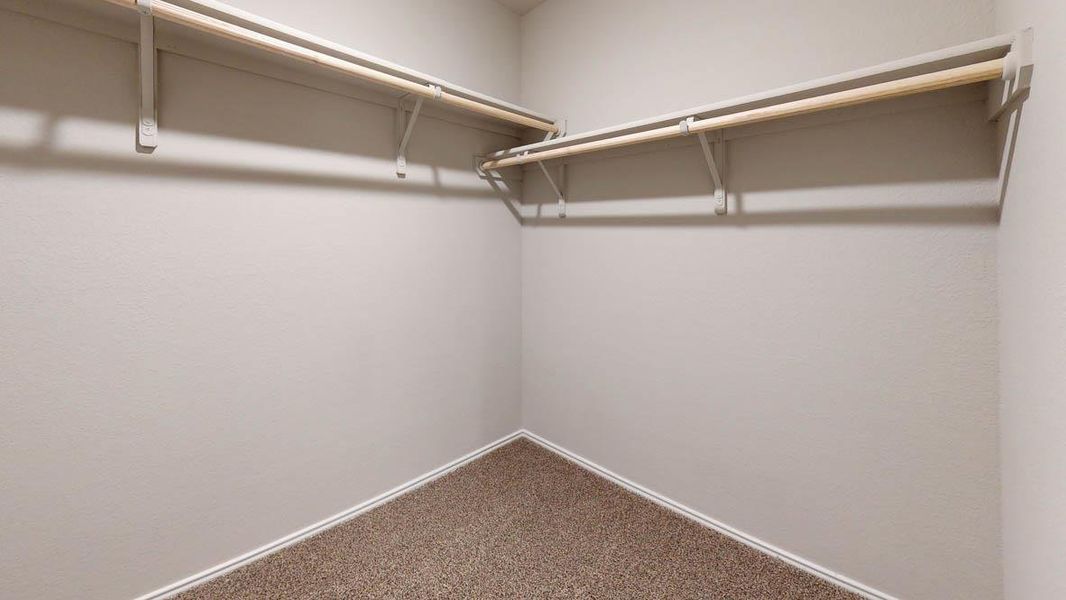 Ample closet space with shelving and hanging rods offers practical storage solutions. Ample closet space with shelving and hanging rods offers practical storage solutions.