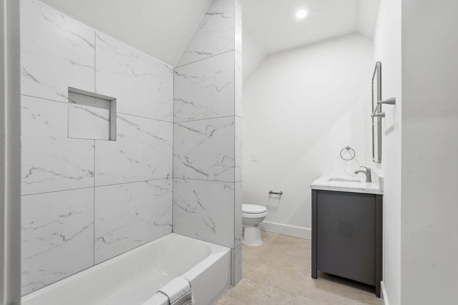 Another full-size bath is situated upstairs just off the flex space.