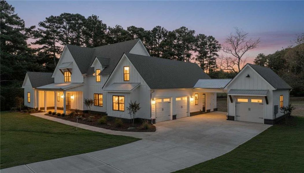 Front exterior of a new home in , Woodstock, GA, highlighting curb appeal (Image 1).