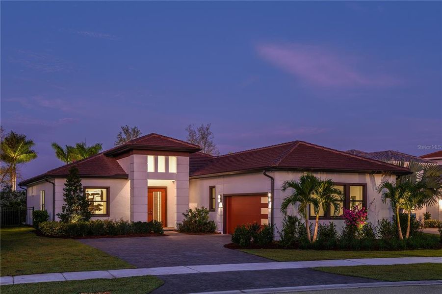 Front exterior of a new home in Cresswind Lakewood Ranch, Lakewood Ranch, FL, highlighting curb appeal (Image 22). Front exterior of a new home in Cresswind Lakewood Ranch, Lakewood Ranch, FL, highlighting curb appeal (Image 22).